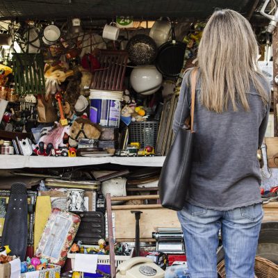 woman-searching-something-buy-antiques-market